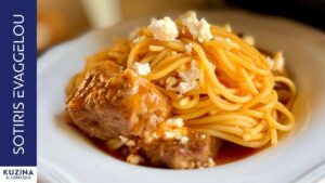 Goat with pasta in tomato sauce